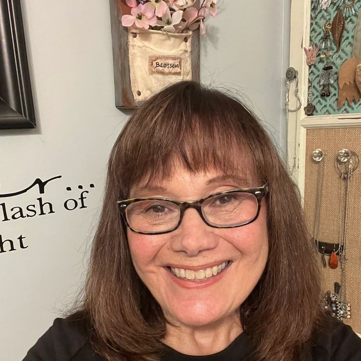 Artisan jeweler working in her studio